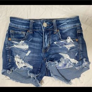 **AMERICAN EAGLE MIDI DISTRESSED SHORTS**
